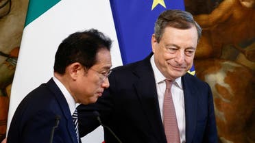 Japanese Prime Minister Fumio Kishida and Italian Prime Minister Mario Draghi leave the stage after delivering a joint statement to the media as they meet at Chigi Palace in Rome, Italy, on May 4, 2022. (Reuters)