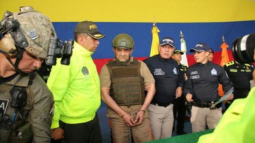 Colombian drug trafficker Dairo Antonio Usuga David, also known as Otoniel, gets escorted by police officers after Colombia extradites him to the United States, in Bogota, Colombia May 4, 2022. Colombia Policia Nacional (PONAL)/Handout via REUTERS ATTENTION EDITORS - THIS IMAGE WAS PROVIDED BY A THIRD PARTY. NO RESALES. NO ARCHIVES