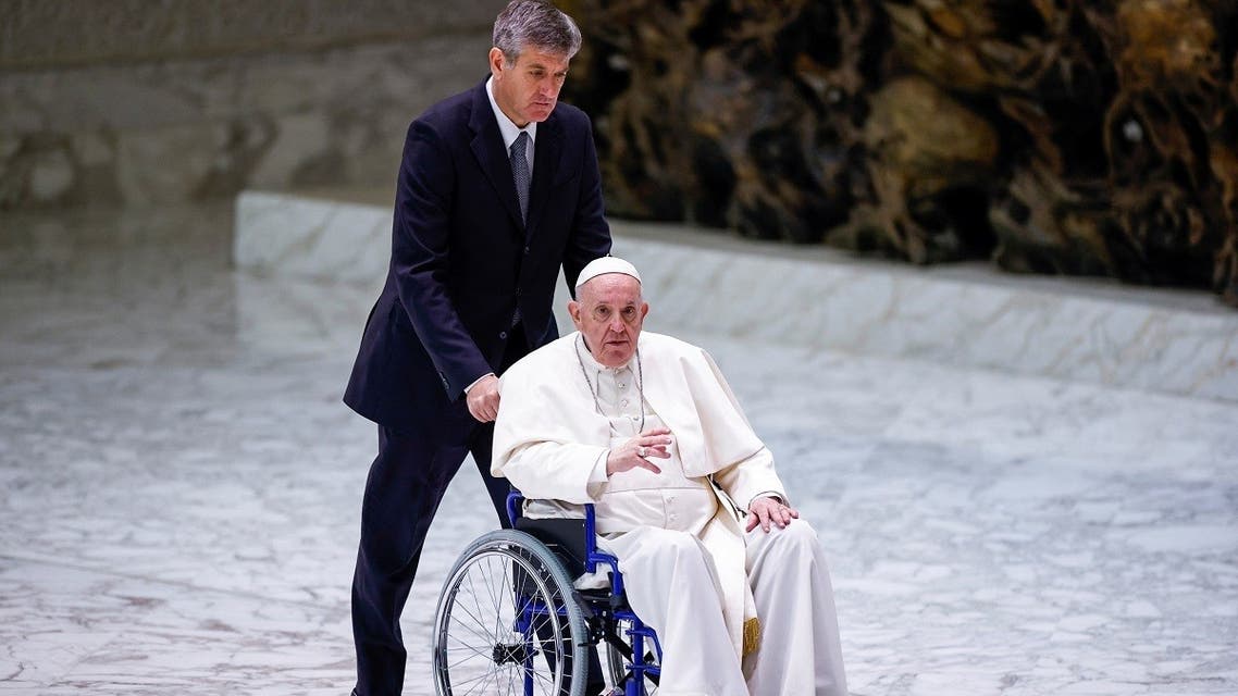 Pope Francis arrives on a wheelchair to meet with participants in the plenary assembly of the International Union of Superiors General (IUSG) at the Vatican, May 5, 2022. (Reuters)