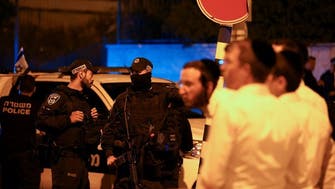 Israel searches for Palestinians suspected of killing three in attack