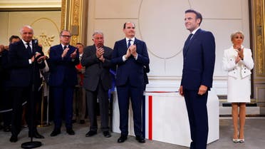French President Emmanuel Macron is applauded as he is sworn-in for a second term as president after his re-election, during a ceremony at the Elysee Palace in Paris, France, May 7, 2022. (Reuters)