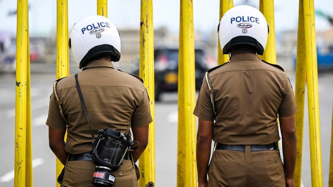 Policemen stand guard outside the Sri Lanka's President Gotabaya Rajapaksa office in Colombo on May 7, 2022. (AFP)