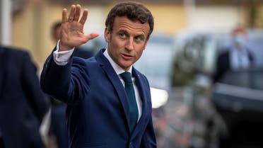 French President Emmanuel Macron waves as he leaves after his visit at Percy Army Hospital in Clamart, near Paris, France, 28 April 2022. Christophe Petit Tesson/Pool via REUTERS