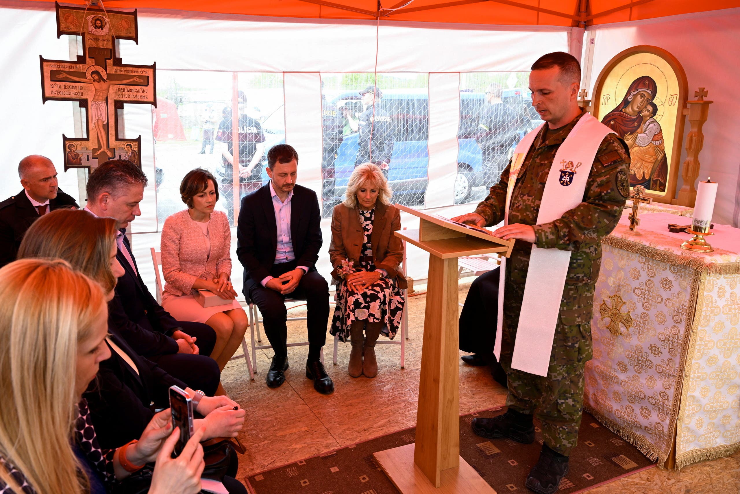 US first lady Jill Biden, Slovakia's Prime Minister Eduard Heger and his wife Lucia attend a prayer led by an army chaplain in Vysne Nemecke, Slovakia, May 8, 2022. (Reuters)