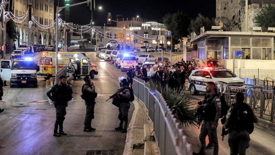 Israeli security forces gather at the scene of a stabbing attack at the Damascus Gate of the Old City of Jerusalem on May 8, 2022. (AFP)