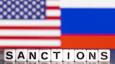 Plastic letters arranged to read Sanctions are placed in front the flag colors of U.S. and Russia in this illustration taken February 28, 2022. (Reuters)
