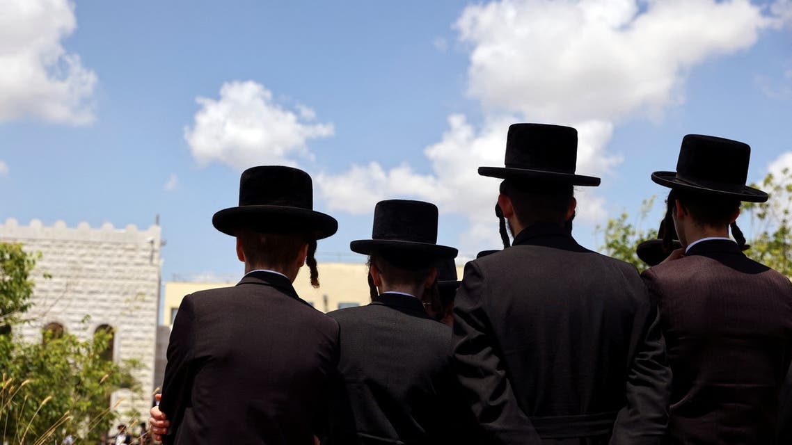 Israelis attend the funeral service of Yonatan Havakuk and Boaz Gol who were killed in what police said was a Palestinian attack, on the country's independence day, in Elad, Israel May 6, 2022. (Reuters)