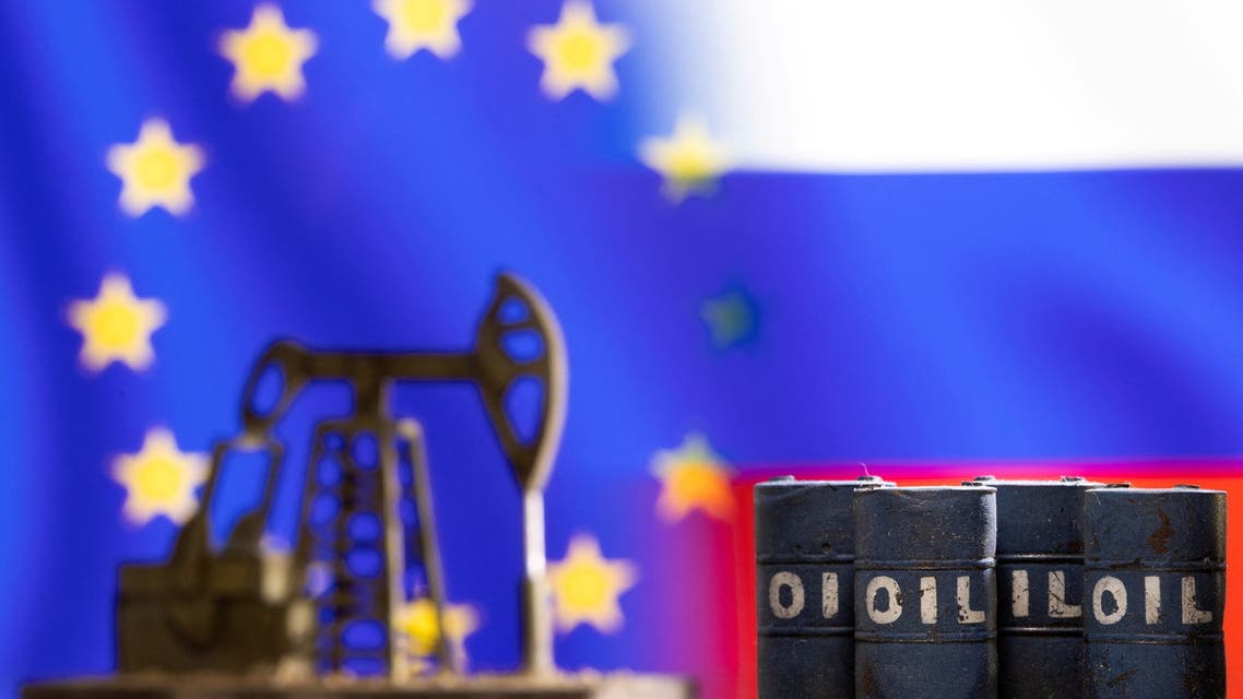 Models of oil barrels and a pump jack are seen in front of displayed EU and Russia flag colours in this illustration taken March 8, 2022. (Reuters)