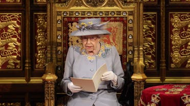 In this file photo taken on May 11, 2021 Britain's Queen Elizabeth II reads the Queen's Speech on the Sovereign's Throne in the House of Lords chamber during the State Opening of Parliament at the Houses of Parliament in London on May 11, 2021. (AFP)