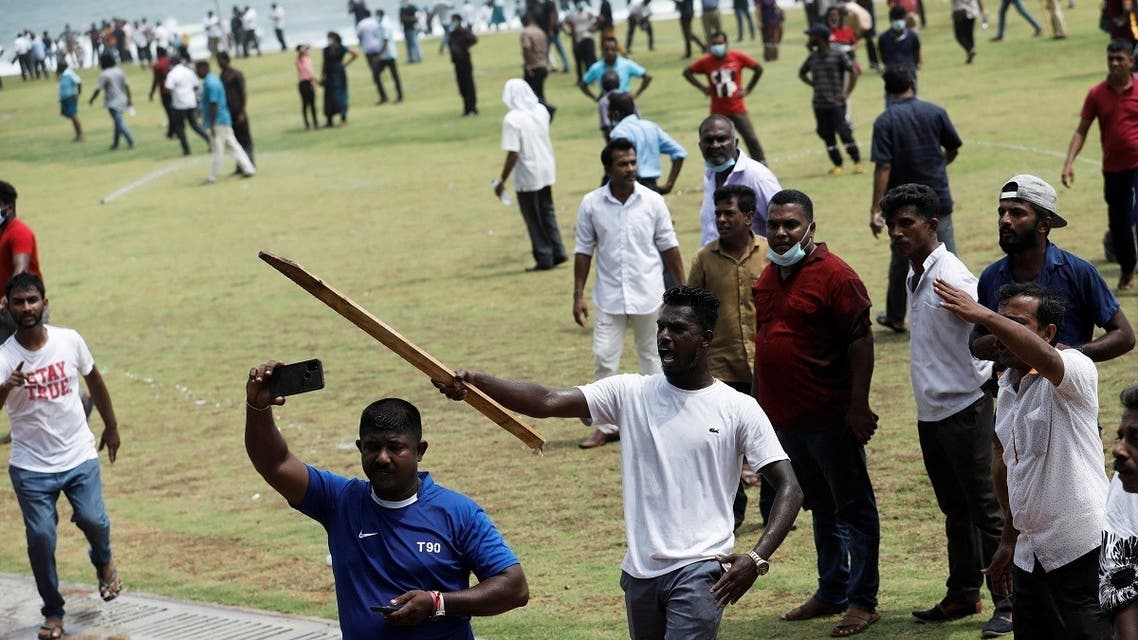 Supporters of Sri Lanka’s ruling party shout at police during a clash with anti-government demonstrators, amid the country’s economic crisis, in Colombo, Sri Lanka, on May 9, 2022. (Reuters)