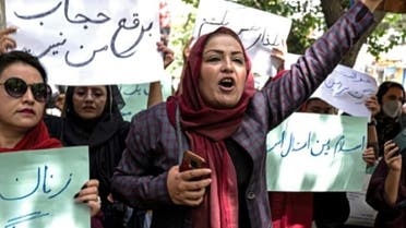 About a dozen women protested in Kabul against the Taliban’s new edict that females must fully cover their faces and bodies when in public. (AFP)