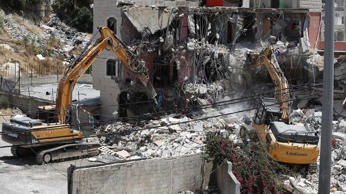 Israeli machinery demolish a Palestinian house in the Arab east Jerusalem neighbourhood of Silwan on May 10, 2022. (AFP)