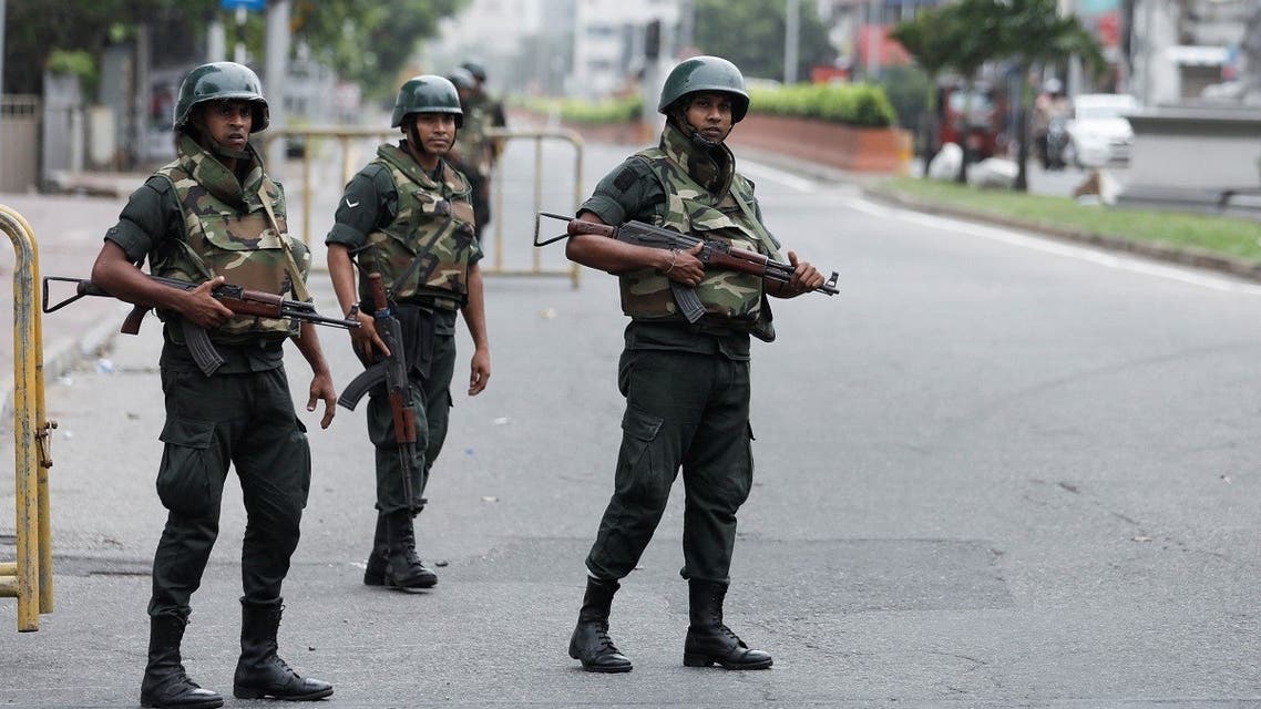 Army soldiers stand guard at a checkpoint near the Prime Minister’s official residence after the government imposed a three-day curfew following clashes between pro and anti-government demonstrators, amid the country’s economic crisis, in Colombo, Sri Lanka, on May 10, 2022. (Reuters)