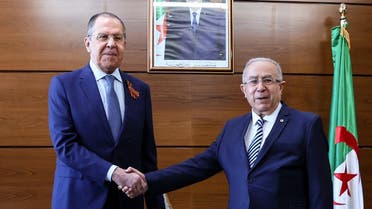 Russian Foreign Minister Sergei Lavrov (L) shake hands with Algeria’s Foreign Minister Ramtane Lamamra during their meeting in Algiers on May 10, 2022. (Handout/Russian Foreign Ministry/AFP)