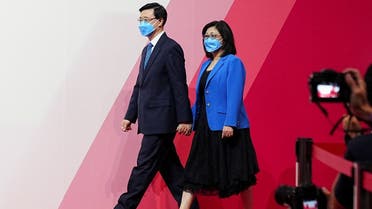 John Lee arrives with his wife Janet Lam Lai-sim at a news conference after being elected as Hong Kong’s Chief Executive, in Hong Kong, China, on May 8, 2022. (Reuters)