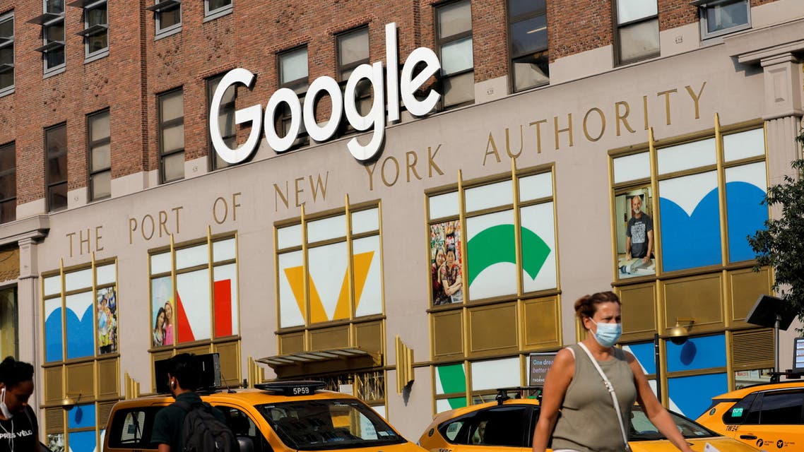 A person in a mask walks by the New York Google offices in New York City. (File photo: Reuters)