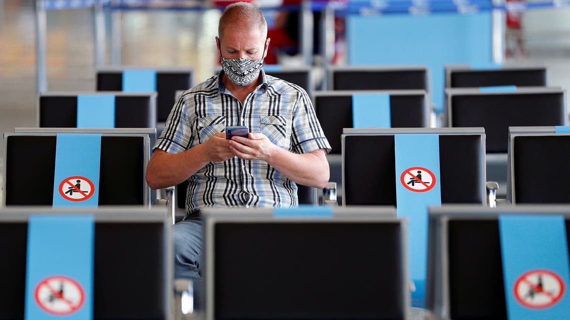 A man wearing a protective face mask sits at Fiumicino Airport, where new security measures have been implemented ahead of a further loosening of movement restrictions on June 3, when Italy is due to reopen its borders to travellers from Europe to unwind its rigid lockdown due to the coronavirus disease (COVID-19), in Rome, Italy, May 28, 2020. (File photo: Reuters)