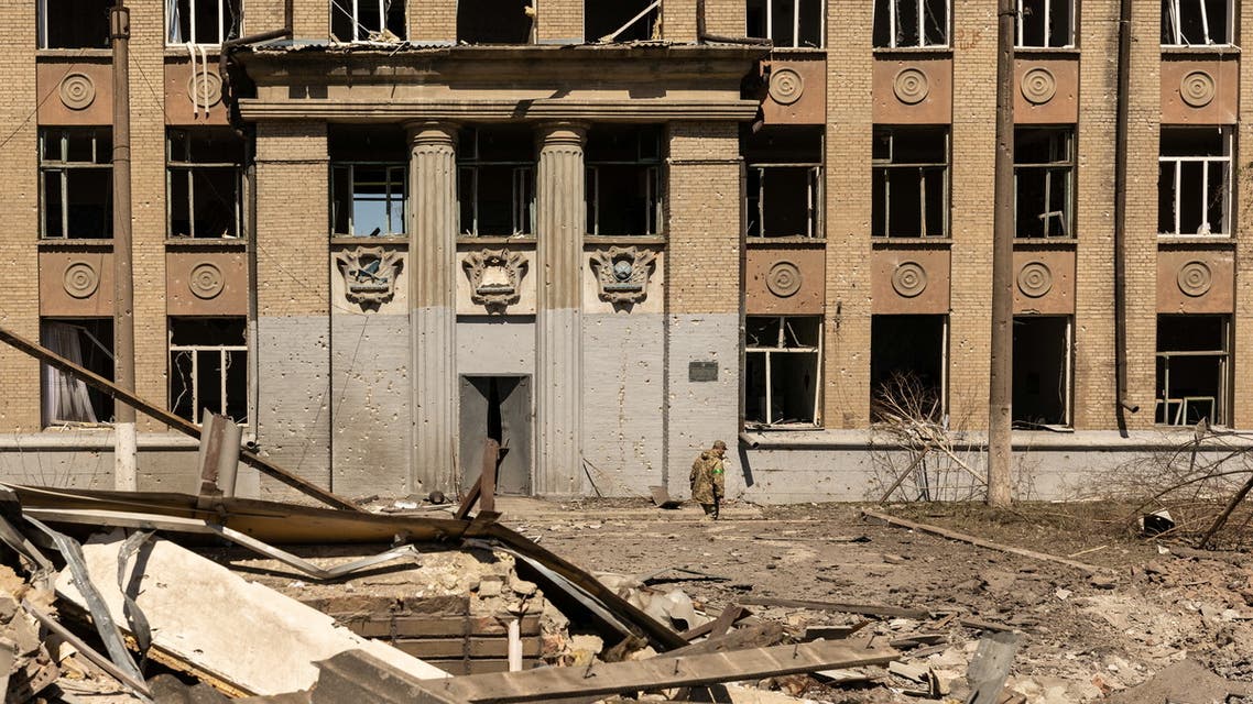 A Ukrainian soldier walks in front of a school that was bombed amid Russia's invasion in Ukraine, in Kostyantynivka, in the Donetsk region, Ukraine, May 8, 2022. REUTERS/Jorge Silva