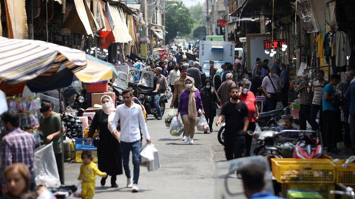 Iranians walk in a market in Tehran, Iran on May 1, 2022. (Reuters)