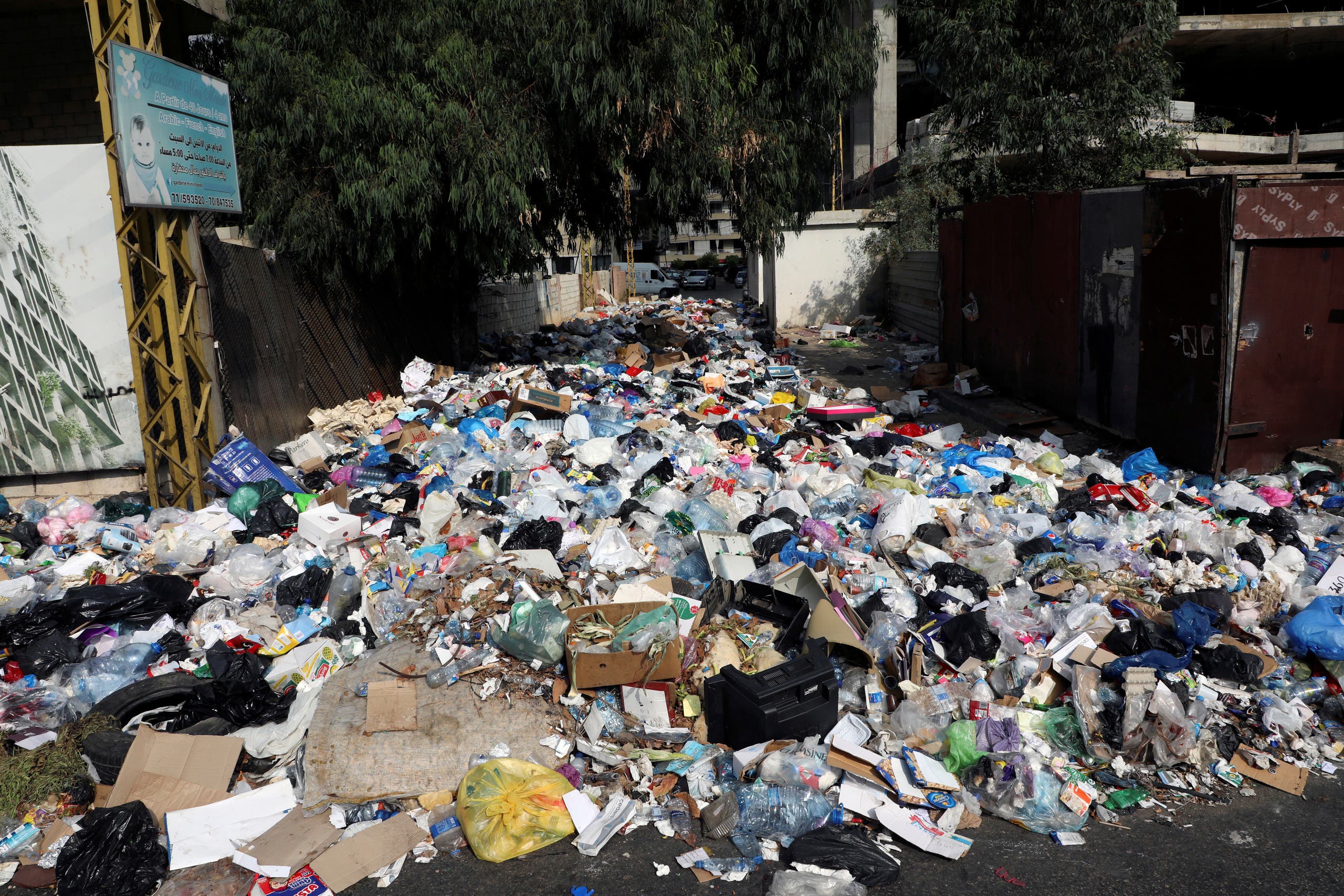 Rubbish piled up is seen along a street in Ain el-Remmaneh, Lebanon September 21, 2020. (Reuters)