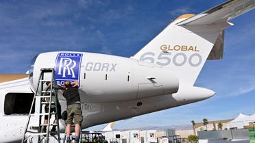 Workers apply Rolls-Royce decal to the engine of a Bombardier Global 6500 business jet at the Bombardier booth at the National Business Aviation Association (NBAA) exhibition in Las Vegas, Nevada, U.S. October 21, 2019. (File photo: Reuters)
