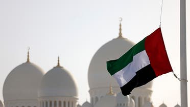 The flag of UAE flies at half mast outside the Sheikh Zayed Grand Mosque in Abu Dhabi on May 13, 2022. (AFP)