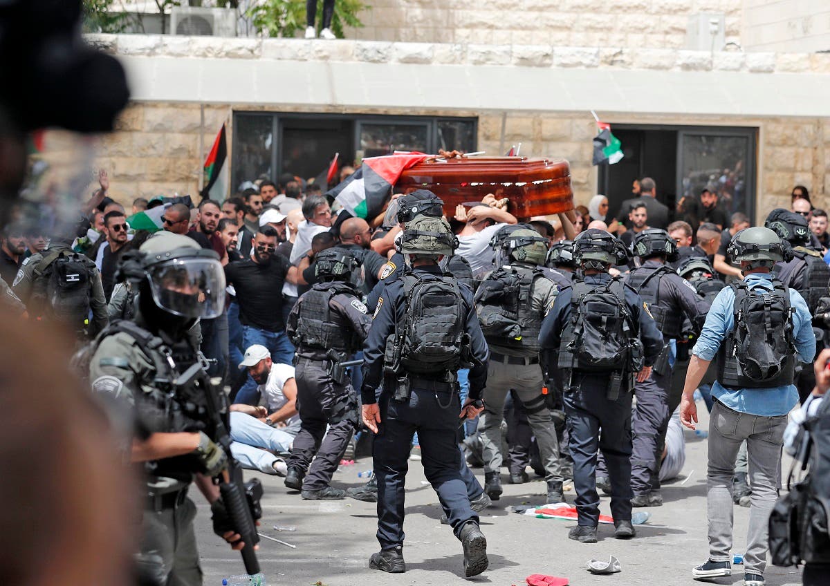 Violence erupts between Israeli security forces and Palestinian mourners carrying the casket of slain Al Jazeera journalist Shireen Abu Akleh out of a hospital, before being transported to a church and then her resting place, in Jerusalem, on May 13, 2022. (AFP)