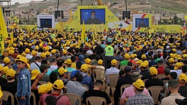 Hezbollah leader Hassan Nasrallah on a screen during a campaign rally in Baalbek on May 13, 2022. (AFP)