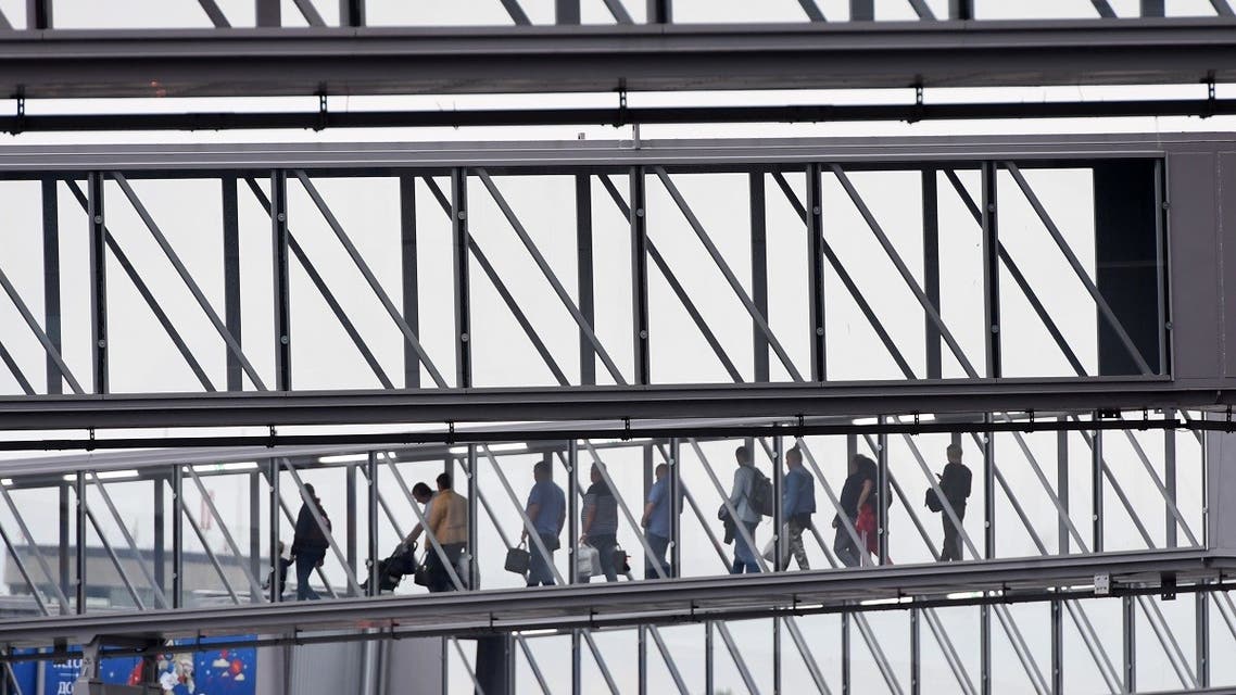 This picture taken on June 11, 2018 shows passengers walking along bridges at Hrabrovo airport in Kaliningrad. (AFP)