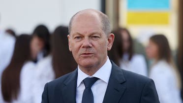 German Chancellor Olaf Scholz addresses the media during a visit of the German-Ukrainian association Blau-Gelbes Kreuz and the women's football team FC Kryvbas (Kryvyi Rih) in Cologne, western Germany, on May 13, 2022. (AFP)