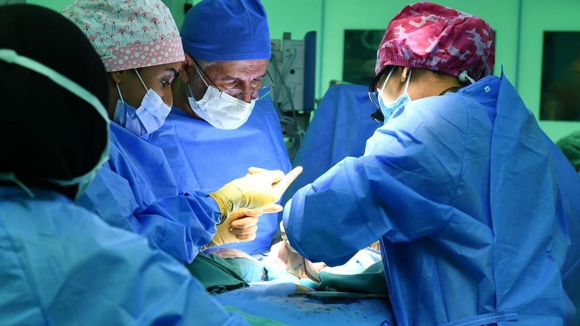 A handout picture provided by the King Salman Humanitarian Aid and Relief Centre on July 31, 2021 shows surgeons operating to separate a pair of Yemeni parasitic twins at the King Abdullah Specialist Children's Hospital in Saudi Arabia's capital Riyadh on July 28. (AFP)