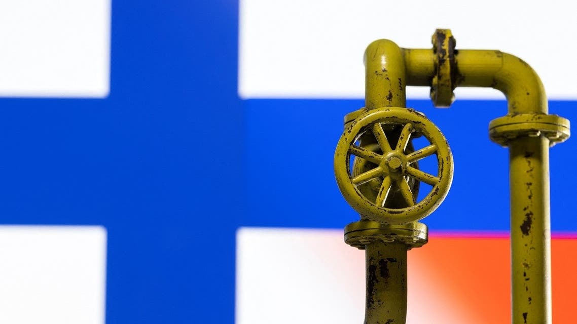 A model of the natural gas pipeline is seen in front of displayed Finnish and Russian flag colors in this illustration taken on April 26, 2022. (Reuters)