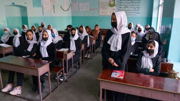 Girls attend a class after their school reopening in Kabul on March 23, 2022. (AFP)