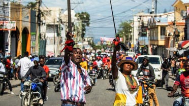 Haitians take to the streets to protest over the increasing insecurity in the Haitian capital Port-au-Prince, on March 29, 2022. (AFP)