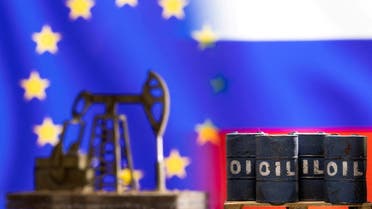 Models of oil barrels and a pump jack are seen in front of displayed EU and Russia flag colours in this illustration taken March 8, 2022. (Reuters)