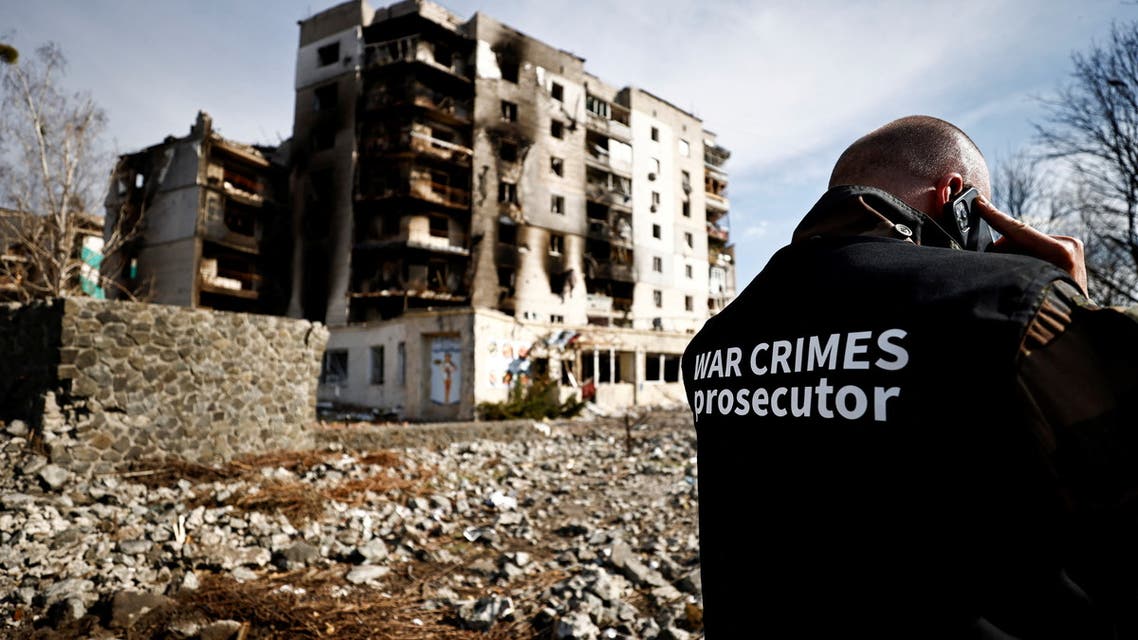 War crime prosecutor's team member speaks on the phone next to buildings that were destroyed by Russian shelling, amid Russia's Invasion of Ukraine, in Borodyanka, Kyiv region, Ukraine April 7, 2022. (File photo: Reuters)