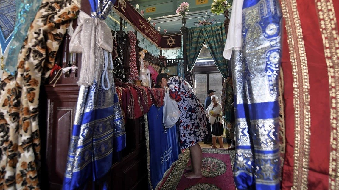 A Jewish pilgrim prays at the Ghriba synagogue in Tunisia’s southern resort island of Djerba on May 18, 2022 during the annual Jewish pilgrimage to the synagogue. (AFP)