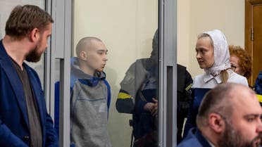 Russian soldier Vadim Shishimarin, 21, suspected of violations of the laws and norms of war, is seen inside a defendants’ cage during a court hearing, amid Russia’s invasion of Ukraine, in Kyiv, Ukraine on May 13, 2022. (Reuters)
