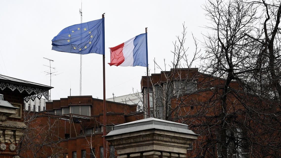 A picture taken on November 10, 2017 shows a European Union flag and a French flag waving in the air at the French embassy in Moscow. (AFP)