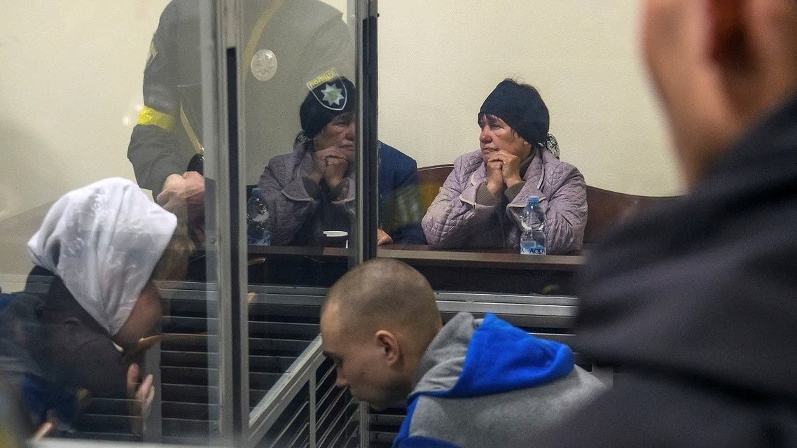 A representative of a victim Kateryna Shelikhova sits next to a Russian soldier Vadim Shishimarin, 21, suspected of violations of the laws and norms of war, during a court hearing, amid Russia’s invasion of Ukraine, in Kyiv, Ukraine on May 18, 2022. (Reuters)