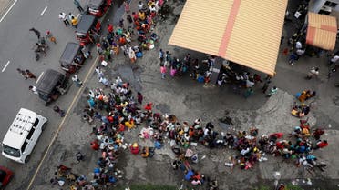 People wait in a queue to buy kerosene at a fuel station, amid the country's economic crisis in Colombo, Sri Lanka, May 18, 2022. (Reuters)