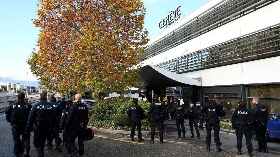 Police officers arrive at the scene as Extinction Rebellion climate change activists block an entrance to general aviation terminal at the Geneva Airport, Switzerland November 16, 2019. (Reuters)