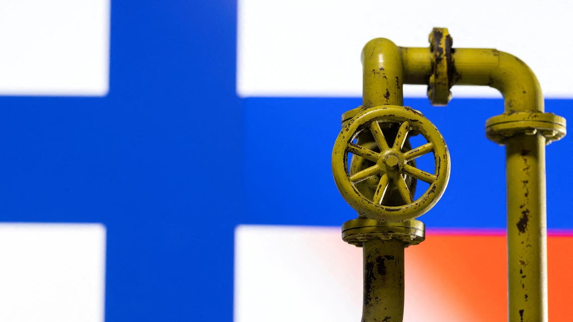 A model of the natural gas pipeline is seen in front of displayed Finnish and Russian flag colours in this illustration taken April 26, 2022. (Reuters)