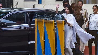 Former media executive Indrani Mukerjea waves as she prepares to sit in a car after leaving the Byculla district jail after she was freed on bail in Mumbai on May 20, 2022. (AFP)