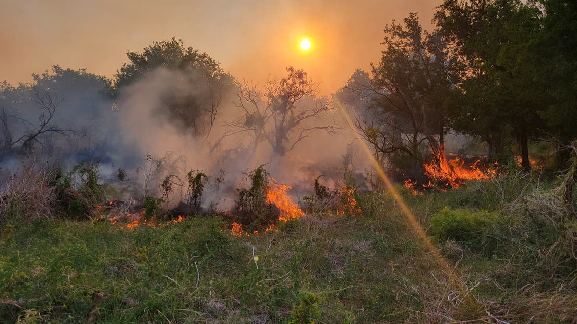 A view of an active fire line as firefighters work to contain the Coconut Fire, a wildfire in Vernon, Texas, U.S., May 18, 2022. (Reuters)