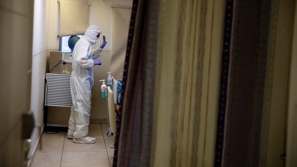 A doctor provides medical care for a patient at a coronavirus disease ward at Tel Aviv Sourasky Medical Center (Ichilov), Tel Aviv, Israel September 21, 2020. (Reuters)