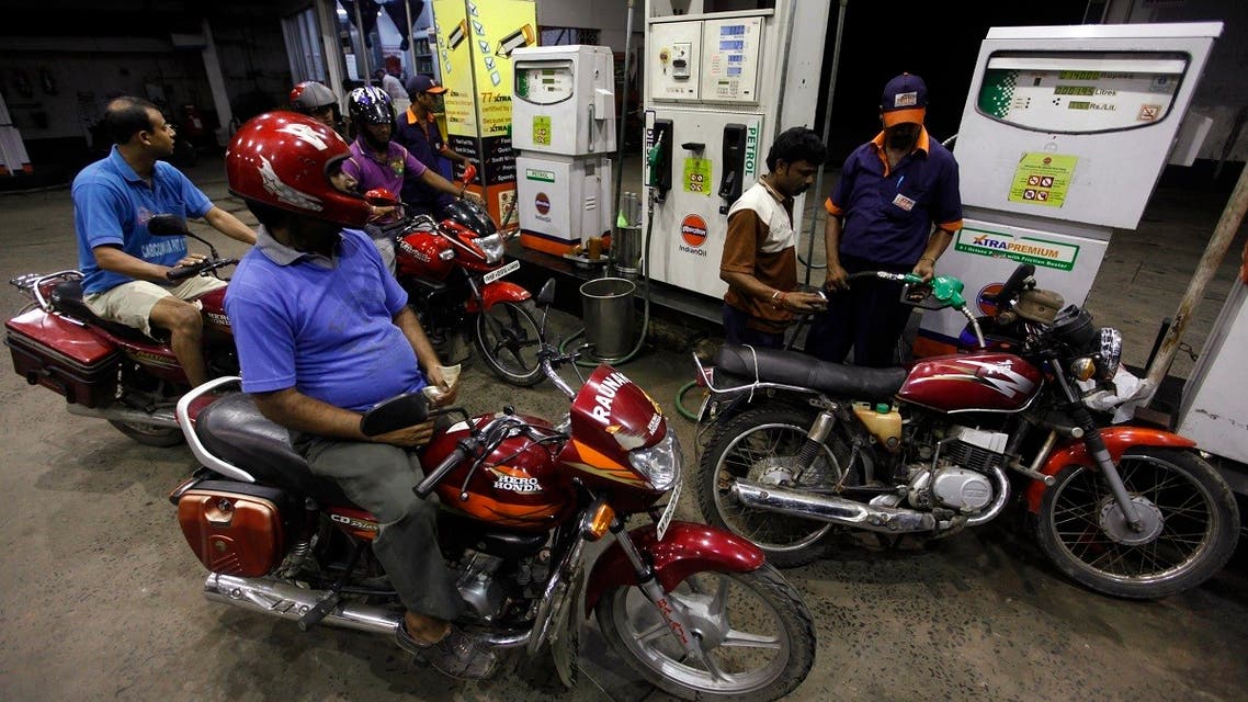2011-09-A worker fills a motorcycle with petrol at a fuel station in Kolkata. (File photo: Reuters)