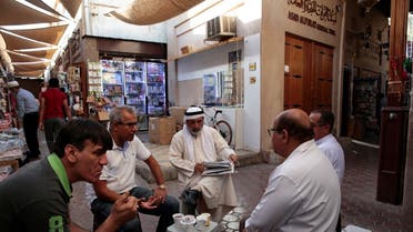 Men talk while having their morning tea in the old souk in Dubai, United Arab Emirates. (File photo: Reuters)