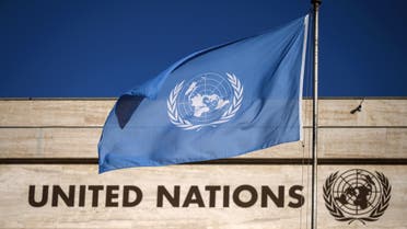 A flag of the United Nations flutters in wind at the main entrance of the Palais des Nations building which houses the United Nations Offices in Geneva, on September 29, 2021. (AFP)