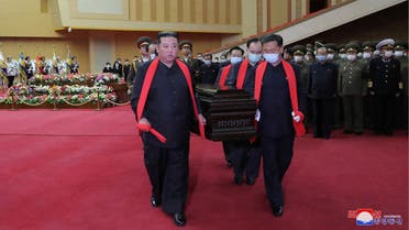 This picture taken on May 21, 2022 and released from North Korea's official Korean Central News Agency (KCNA) on May 22 shows North Korean leader Kim Jong Un (L) carrying the coffin of Marshal of the Korean People's Army Hyon Chol Hae, general adviser to the Ministry of National Defence of the DPRK, at the April 25 House of Culture in Pyongyang. (AFP)